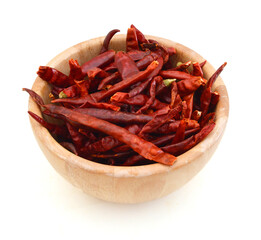dry red pepper in wooden bowl on white background
