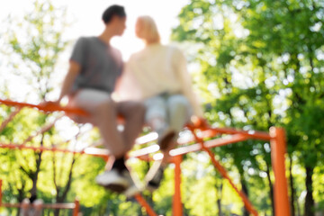 Out of focused image of couple on a playground