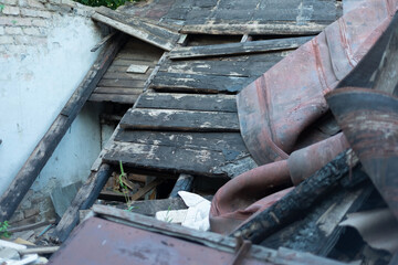 the roof of the burnt building collapsed. Debris filled the room of the house. Ruins, white brick, wall, texture, wallpaper, disaster