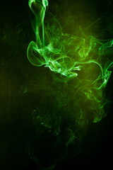 Green smoke motion on black background.