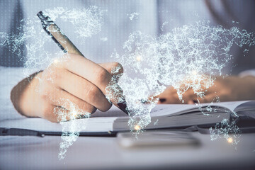 Social network theme hologram over hands taking notes background. Concept of global international...