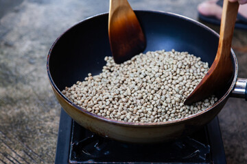 Traditional roasting coffee at home,  freshly roasted coffee beans.