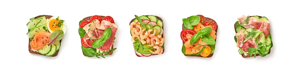 Foto op Plexiglas Open sandwiches with vegetables, avocado, tomato, mozzarella, egg and soft cheese. Homemade sandwich collection with salmon, ham, cucumber, radish, herbs isolated on white, top view © evgenij918