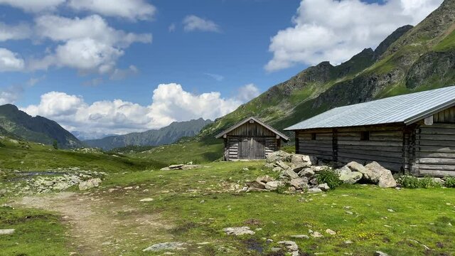 Old barns on the shore of the Lake Giglachsee in the Styrian Tauern - Austria. The place without  tourists after the coronavirus pandemic.