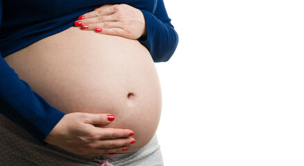 Close-up of pregnant woman grabbing her tummy with copy-space
