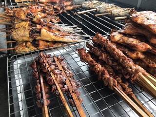 Many wooden grilled chicken offal.