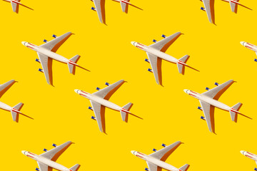 Children's plane on a yellow background seamless pattern