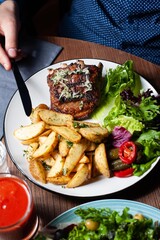 pork ribs, fried potatoes, salad mix

