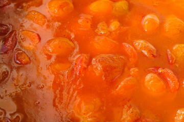 The surface of apricot or peach jam. Copy space.