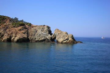 Fototapeta na wymiar Rocks with a cave in the mediterranean sea in Turkey.