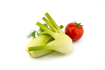 Fresh fennel and red tomato over white