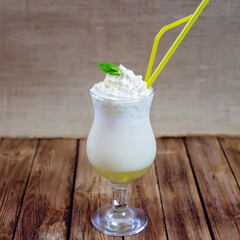 Cocktail with cream and a sprig of mint
