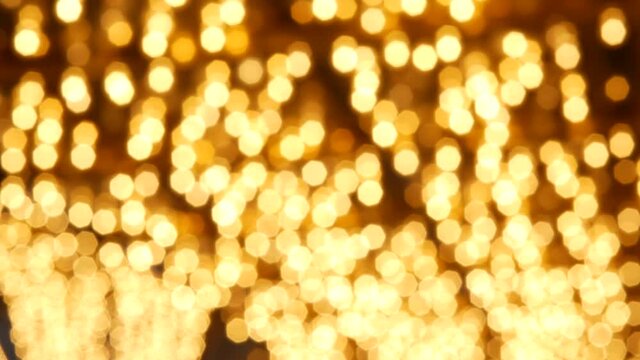 Defocused old fasioned electric lamps glowing at night. Abstract close up of blurred retro casino decoration shimmering, Las Vegas USA. Illuminated vintage style bulbs glittering on Freemont street.