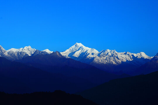 A panoramic view of Mt Kanchenjunga with first rays of sunlight falling on it as seen from Hanuman top in Gantok Sikkim India