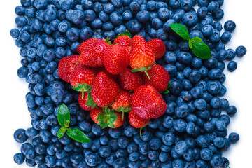 Blueberries and strawberries background.