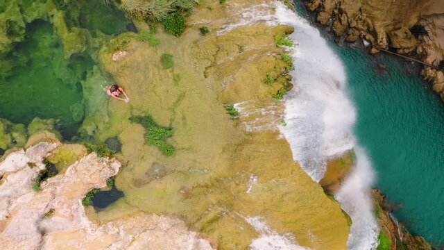 Aerial view of Tamul Waterfall with turquoise water in San Luis Potosi, Mexico.