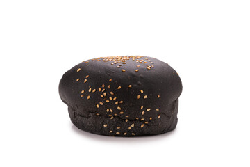 Black burger bread isolated on white.