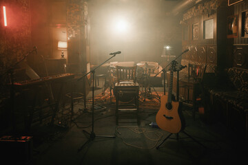 Empty stage of a small unplugged live music concert - obrazy, fototapety, plakaty