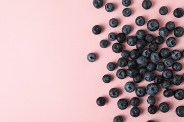 Delicious fresh blueberry on pink background, top view