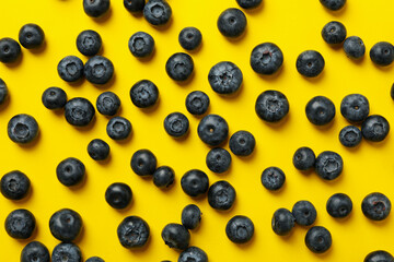 Delicious fresh blueberry on yellow background, top view