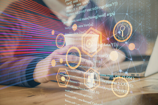 Double exposure of data internet theme hologram with man working on computer on background. Concept of innovation.