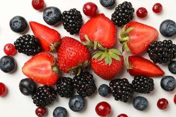 Fototapeta na wymiar Mix of fresh berries on white background, top view