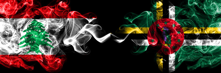 Lebanon vs Dominica smoky mystic flags placed side by side. Thick colored silky abstract smoke flags.