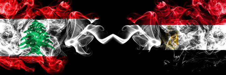 Lebanon vs Egypt, Egyptian smoky mystic flags placed side by side. Thick colored silky abstract smoke flags.