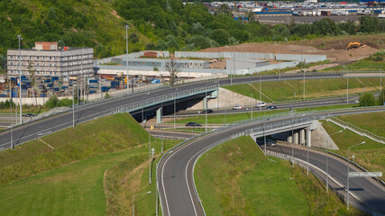 Outskirts of Moscow. A road junction in an industrial area of a modern metropolis. Aerial view