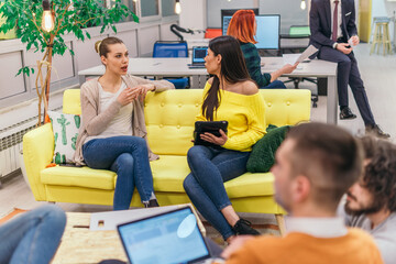 Multiethnic group of employees working in a google environment company. Group of colleagues working on a project in modern offices