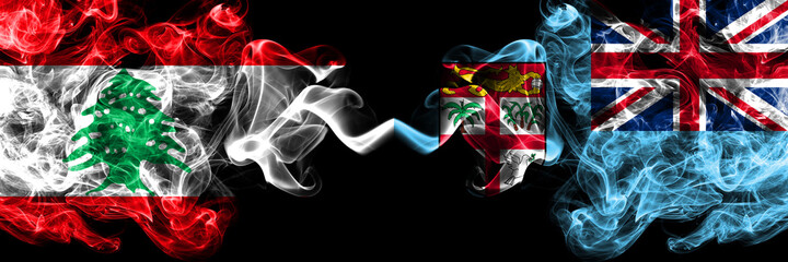 Lebanon vs Fiji smoky mystic flags placed side by side. Thick colored silky abstract smoke flags.