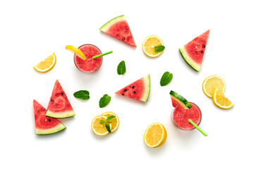 Watermelon, lemon colorful isolated on white background. Fresh red yellow watermelon slices, citrus creative composition, top view. Lemonade in glass, fashionable trendy summer beverage, flat lay