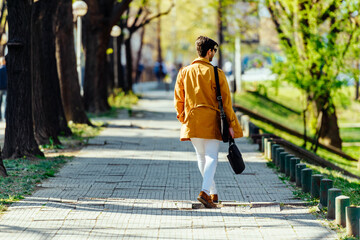 Fine businessman walking with bfriefcase