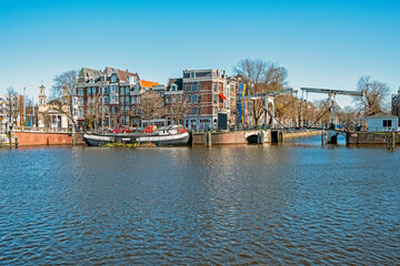 City scenic from Amsterdam at the river Amstel in the Netherlands