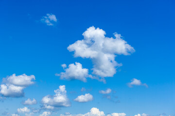 Naklejka na ściany i meble Blue sky background with white clouds, nature