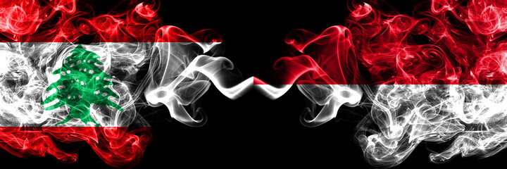 Lebanon vs Monaco, Monacan smoky mystic flags placed side by side. Thick colored silky abstract smoke flags.