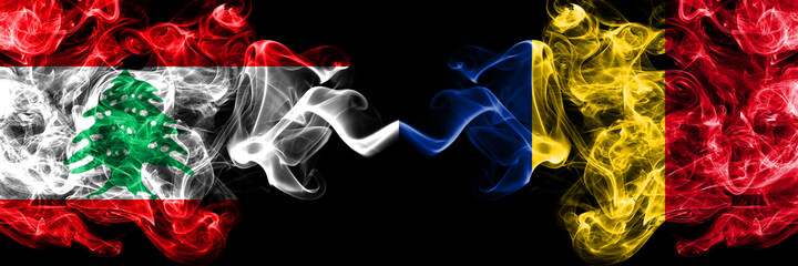 Fototapeta premium Lebanon vs Romania, Romanian smoky mystic flags placed side by side. Thick colored silky abstract smoke flags.