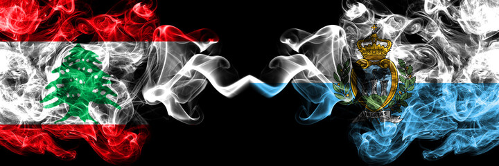 Lebanon vs San Marino, Sammarinese smoky mystic flags placed side by side. Thick colored silky...