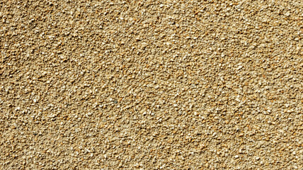 yellow texture wall made of small stones, backgrounds, textures
