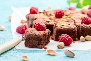 Brownie slices with dark chocolate, raspberries and sea salt.