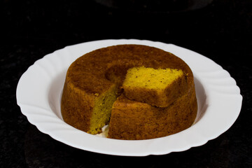 Homemade sweet and tasty cake on dark background