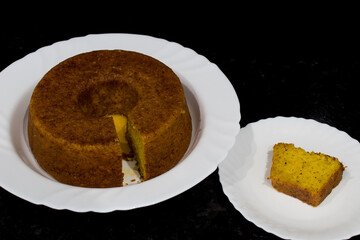 Homemade sweet and tasty cake on dark background