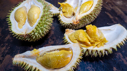 Ripe Durian special selected for durian lovers ready to eat condition,on wood background. Durian is known as King of fruits. It is smelly and the shell is covered with thorns