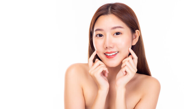 Happy beautiful asian woman touching her beauty cheeks with smile face. Attractive young lady has perfect facial skin. Cosmetology, beauty and Spa concept. isolated on white background, copy space