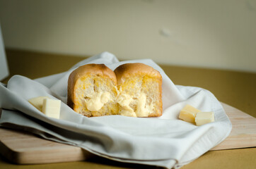 Cheese Bread on a wooden cutting board fabric
