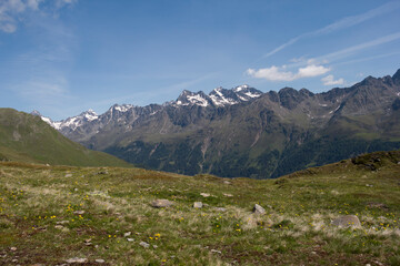 Fototapeta premium Typical landscape of Austria, summer background. Background with fields, mountains and blue skies