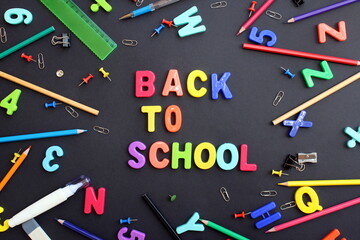 The words back to school are written on a black background