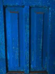 Handmade blue old wood decoration. Wooden door texture background.