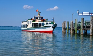 Steamboat at a landing stage on lake Chiemsee in Bavaria. 