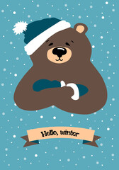 Vector flat illustration of a cartoon bear in a hat with a pompom and mittens. On a blue background with flakes of snow and the inscription: Hello, winter. New-year/ Christmas card, print, web